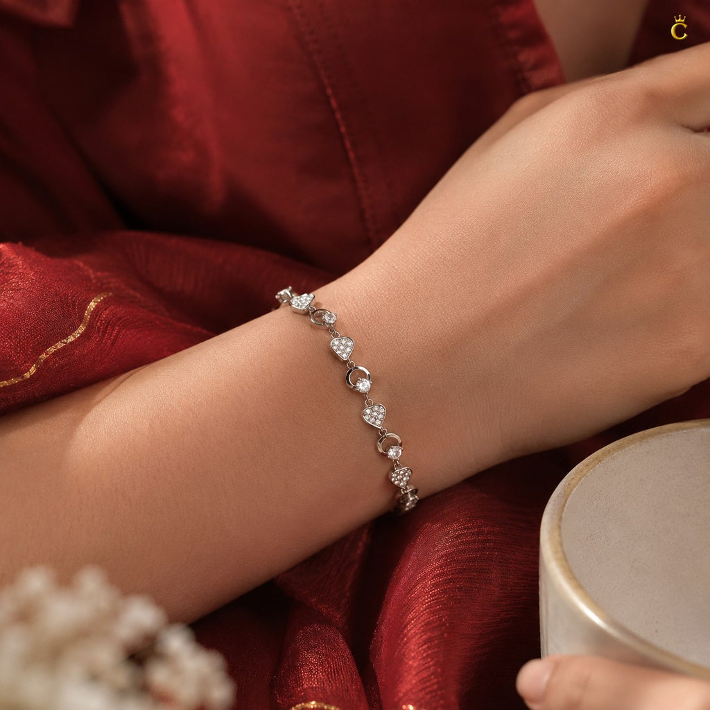 Interlocking Heart and Solitaire Silver Bracelet