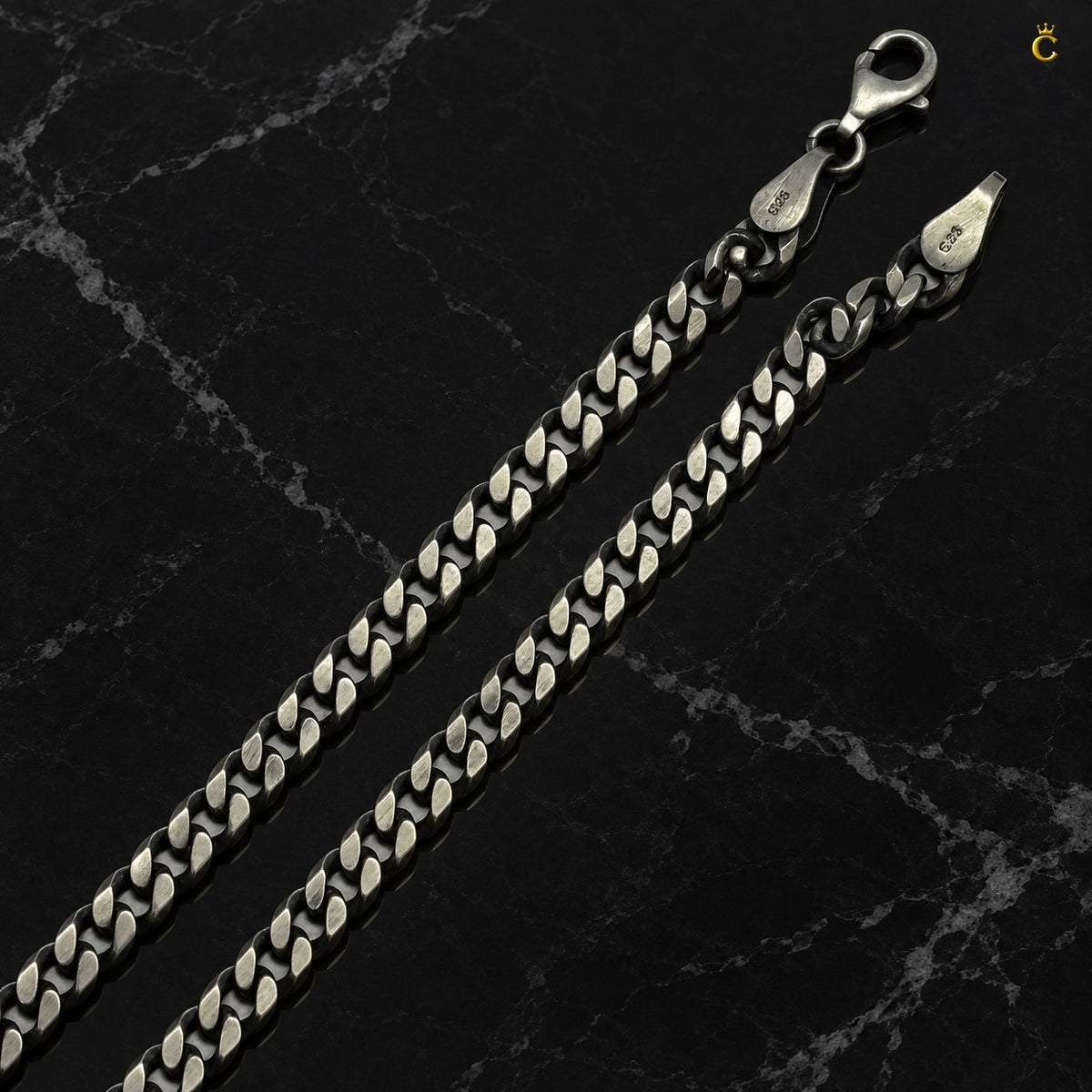 Royal Cuban-link style bold oxidized. Silver chain